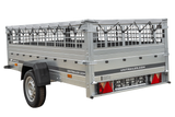 Einachsiger Anhänger auf Blattfedern 264×125 UNITRAILER GARDEN 264/R KIPP mit Gitterseitenwänden, H-0-Rahmen und grauer Plane-Neu